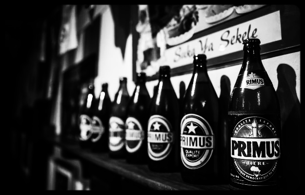   heat off the pavement dances in time to ngoma and bell at mbongi we arrive   with each finger washed this is how we arrive at mbongi  