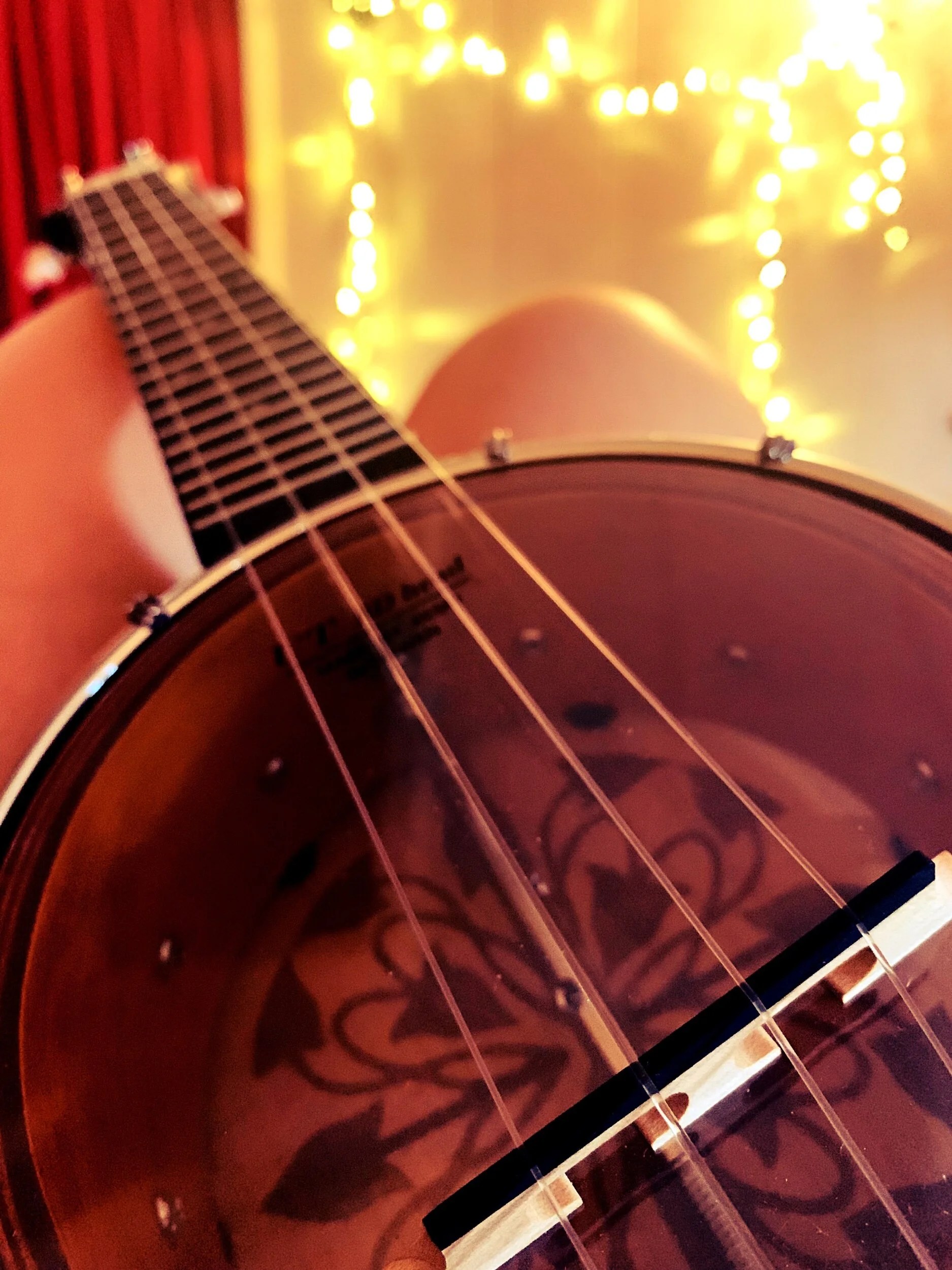  Laying in bed practicing, “No woman no cry” by Bob Marley on my banjolele.  